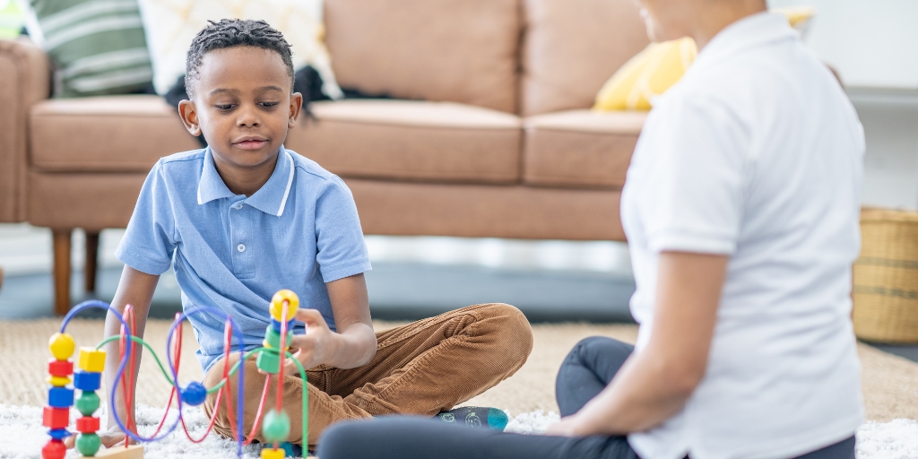 Child participating in fine motor skills ABA Therapy