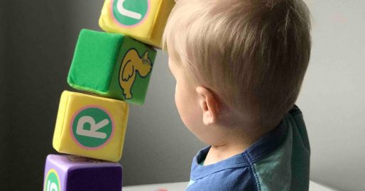 child-with-autism-stacking-blocks